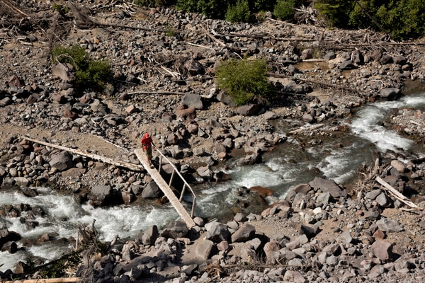 HIker crossing the Inter Fork