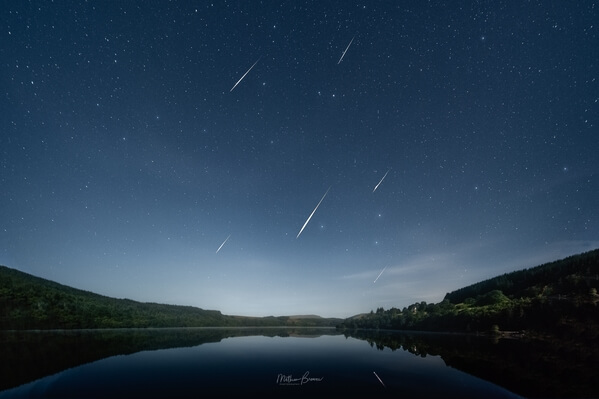 Composite of several Perseid meteors over the reservoir