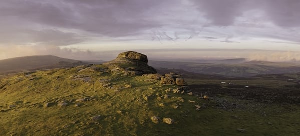 A Winter sunrise standing on Haytor looking west at Lowman's Rock.