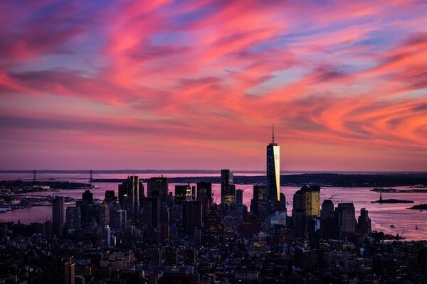 Colorful sunset behind the Lower Manhattan, as seen from the Empire State Building