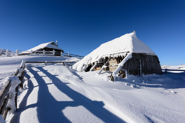 Snow covered huts