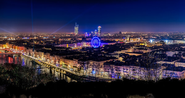 Lyon during the festival of lights 2016 seen from the Garden of Curiosities. We can see the towers of the Part Dieu district and the big wheel on the Bellecour square.