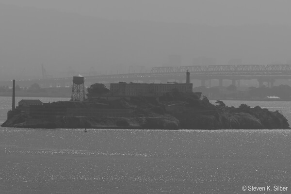 Alcatraz Island from Vista Park.  The San Fransisco Bay Bridge is in the background.
