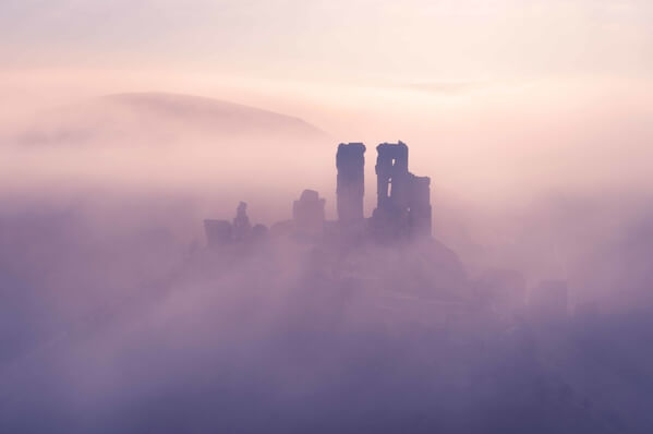 Corfe Castle is at its finest, during the spring and autumn months when mists swirling round the castle are most likely.