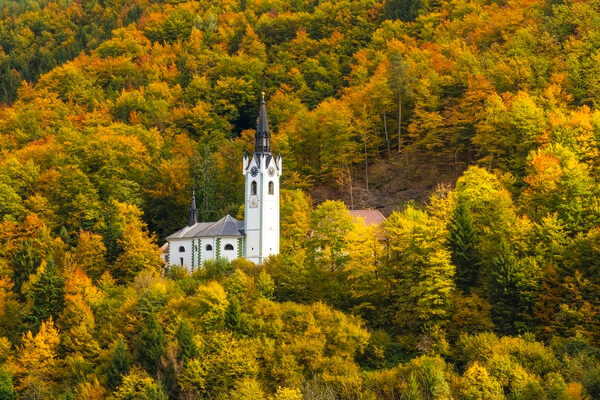 The church of St. Mary above Kropa town in autumn.