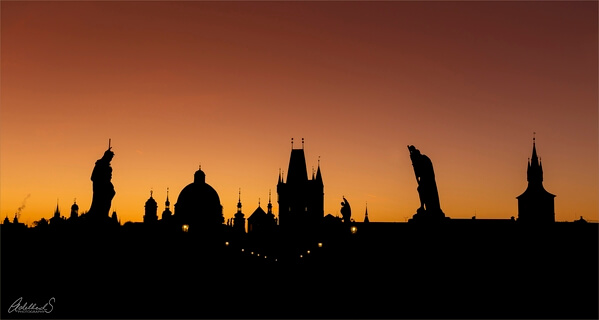 Charles Bridge silhouette on a crowded morning in september