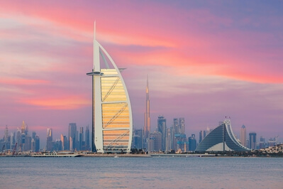 This is a super spot to photograph the Burj al-Arab against the glittering skyline of Dubai. Using a long lens helps to compress the image and bring the skyline 
