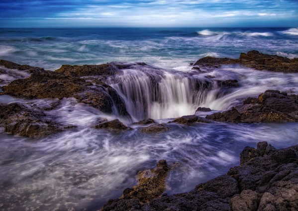 Although Thor’s Well is best shot at high tides, this shot taken at a lower tide but with  considerable storm surge. 