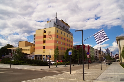 South end of Slovenska street with former hotel Diana and flags of FC Mura fans