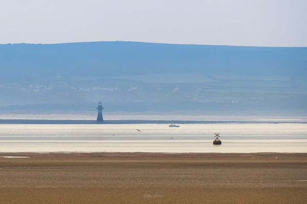 Whiteford Lighthouse captured from here on a hazy day with a big telephoto