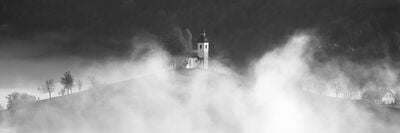 The Church breaks through the mist as the sun broke through from behind a bank of cloud.  The light was harsh by this stage, however, it converted well to a black and white image.248mm. F9, !SO 125, 1/250s