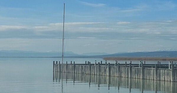 Taken from the beach just inside the park shooting across the lake, catching the snow-capped mountains in Lower Austria (zoom in, they are there)