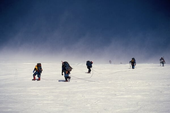 Rope teams approaching Summit on a windy day