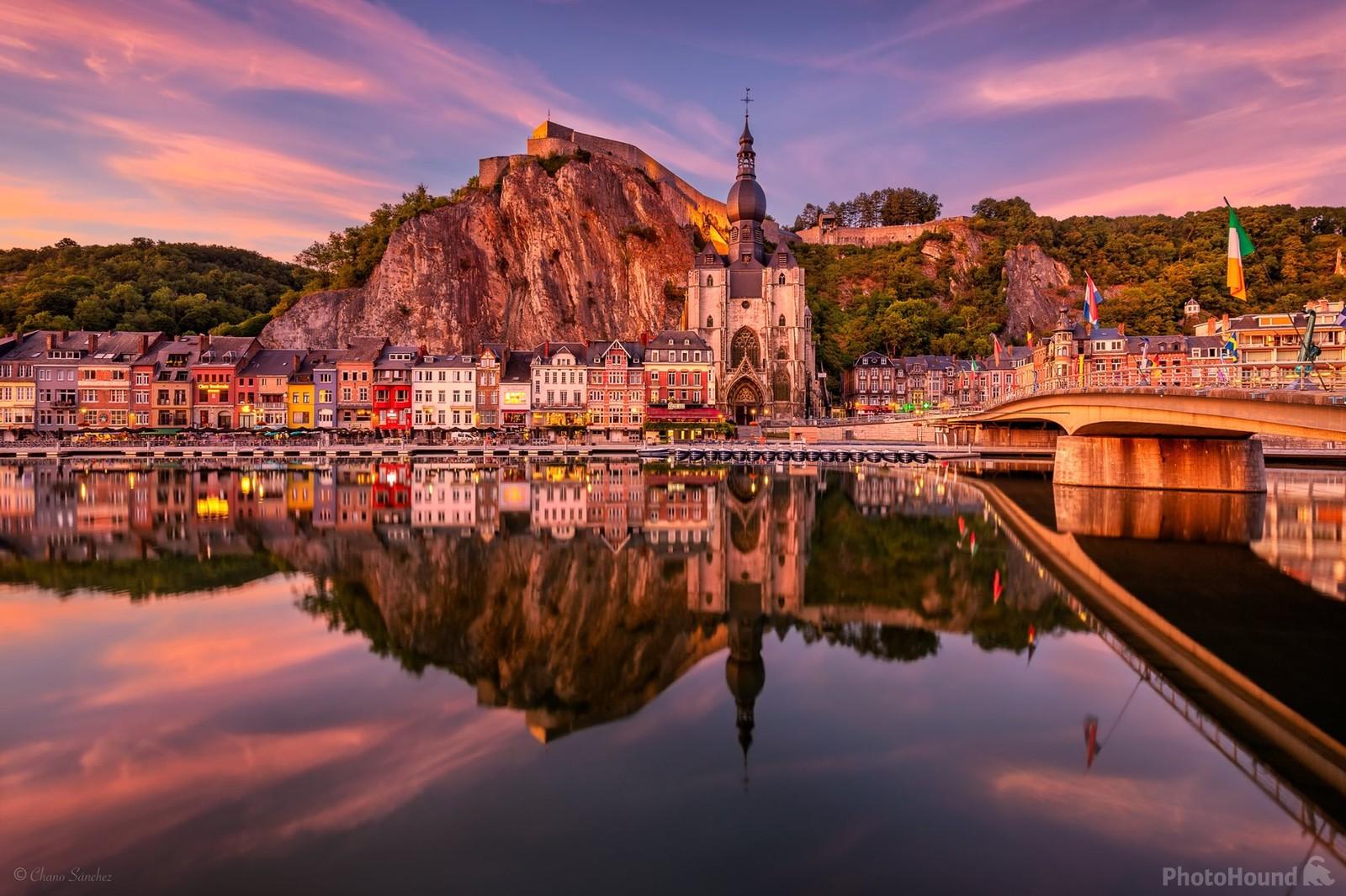 Image of Dinant reflection on the Meuse river at twilight  by Chano Sanchez
