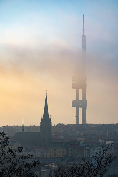 Morning autumn fog running over the Žižkov district with the dominant of Television Tower