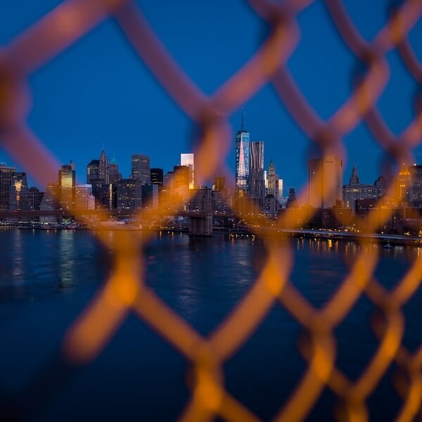 View through the upper part of the fence on the Manhattan Bridge