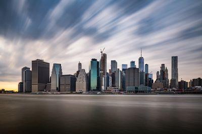 Moving clouds above the Lower Manhattan panorama.Long exposure shot.