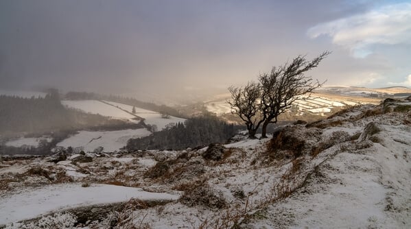 Yar Tor looking northwest on a snowy sunset in winter.
