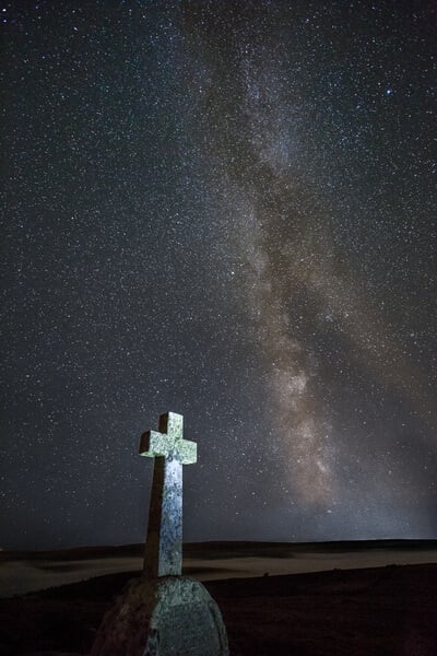 Cave Penny Cross in September with the milky way core behind (with an inversion in the valley behind)