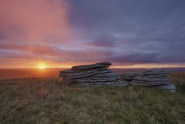 One of the rock stacks at Wild Tor at sunrise in summer.