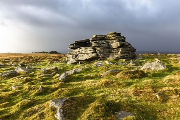 A late morning burst of light during winter of the 2 main rock stacks, looking south towards Pil Tor in the distance.