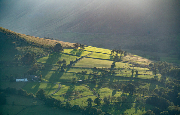 Light casting shadows in the fields of the Newlands Valley
