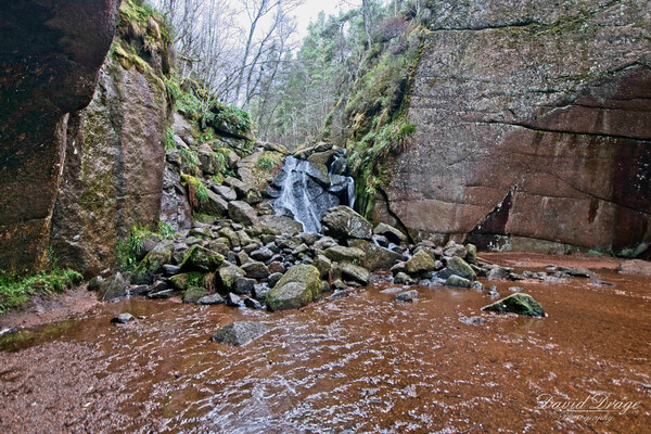 Standing within the Burn O Vat, an "open-topped" cave or gorge caused by glacial runoff.  Waterproof walking boots or wellies are essential if you want to keep your feet dry.
