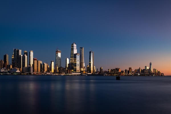 Midtown Manhattan and Lower Manhattan panorama after sunset.