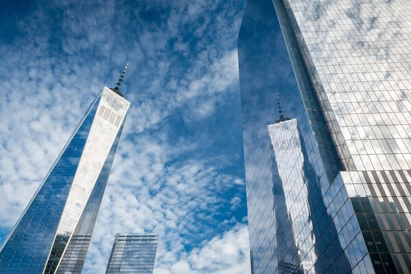 One World Trade Center reflecting in the glass wall of Four World Trade Center.