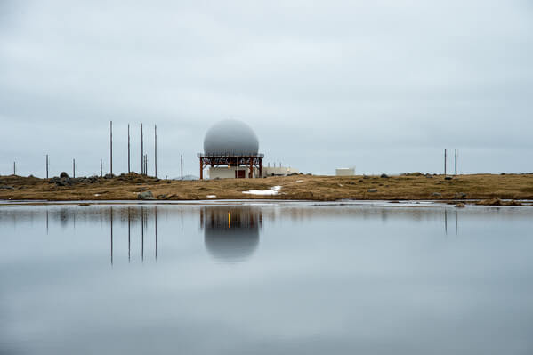 Radar station reflected in a pool