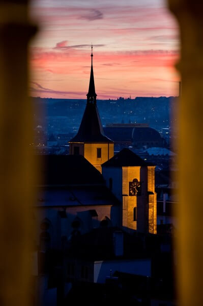 View through the window of Old Town Hall Tower after sunset