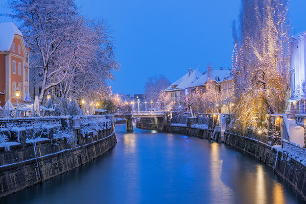 Ljubljanica river in snow and lights