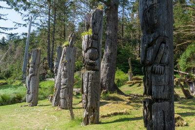 Monumental poles of the Haida Heritage Site of S'gang Gwaay Llnagaay