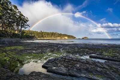 Tessellated Pavement, Tasmania, photographed some time before sunset. I was complaining about the rain for some time .... but not for too long :-) I wish I had my tripod ready for some longer exposure tries, but it took too long and the rainbow was as quickly gone as it appeared.