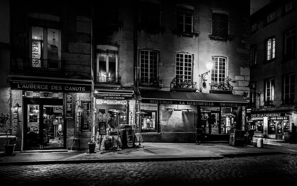 St-Jean square in the Old Lyon by night in B/W. The St-Jean square is the nipple center of the Saint-Jean district, and more generally of the whole district of Old Lyon. It constitutes the forecourt of the Primatiale Saint-Jean. To the north is St-Jean Street, the main pedestrian artery of the Renaissance district.