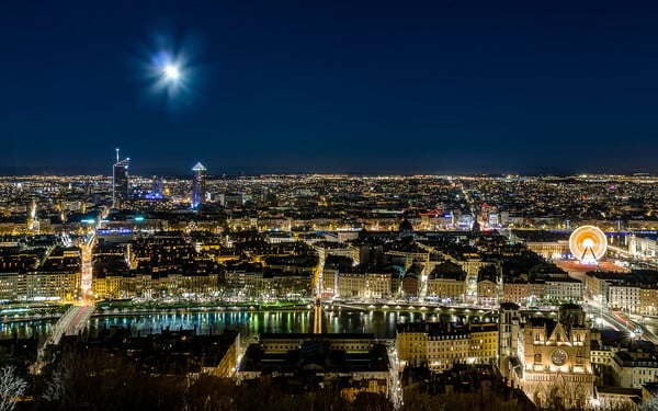 Lyon view from the esplanade of the basilica of Fourviere. We can see the St Jean Cathedral, the courthouse, the courthouse footbridge, the  Bellecour square (and the big wheel), the Part Dieu tower, the Incity tower, the Oxygene tower and ... the full moon