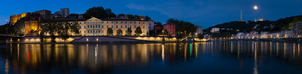Blue hour on the Saone in Lyon seen from the dock of chauveau. On the other side, we can see the Department of Cultural Affairs, the St-Jean fortress and in the background the tower and the Basilica of Fourviere.