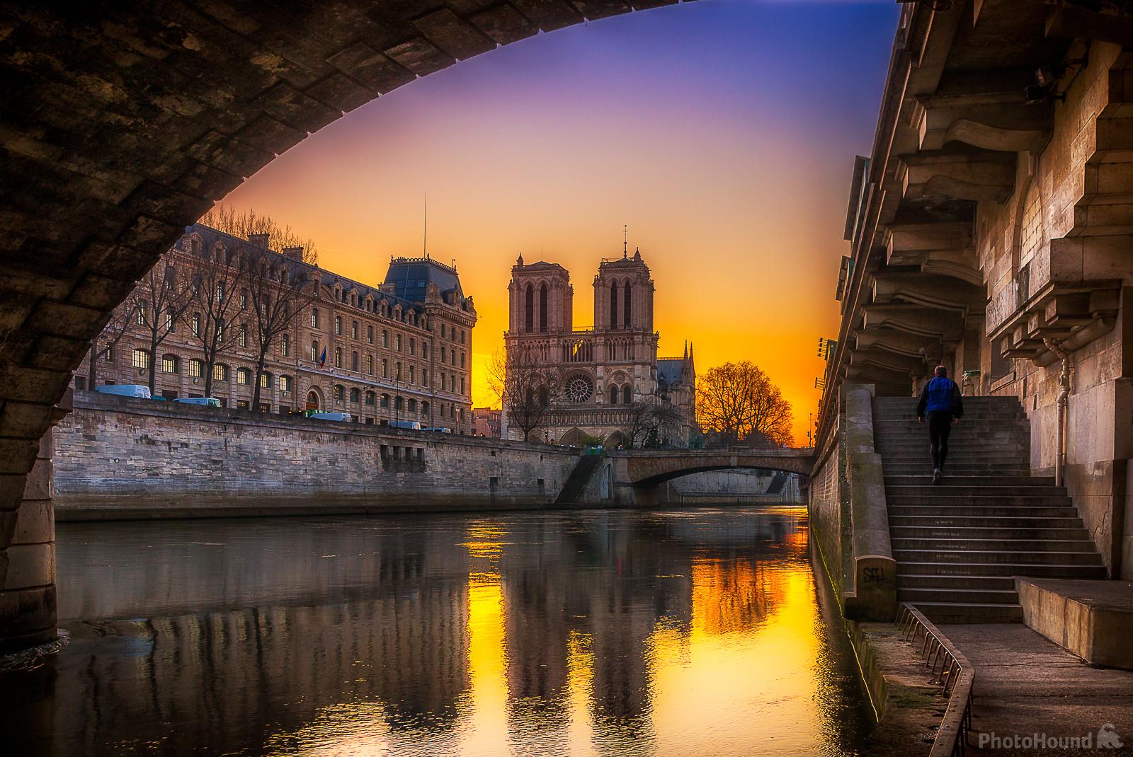 Image of Notre Dame de Paris from beneath Pont St-Michel by Frédéric Monin