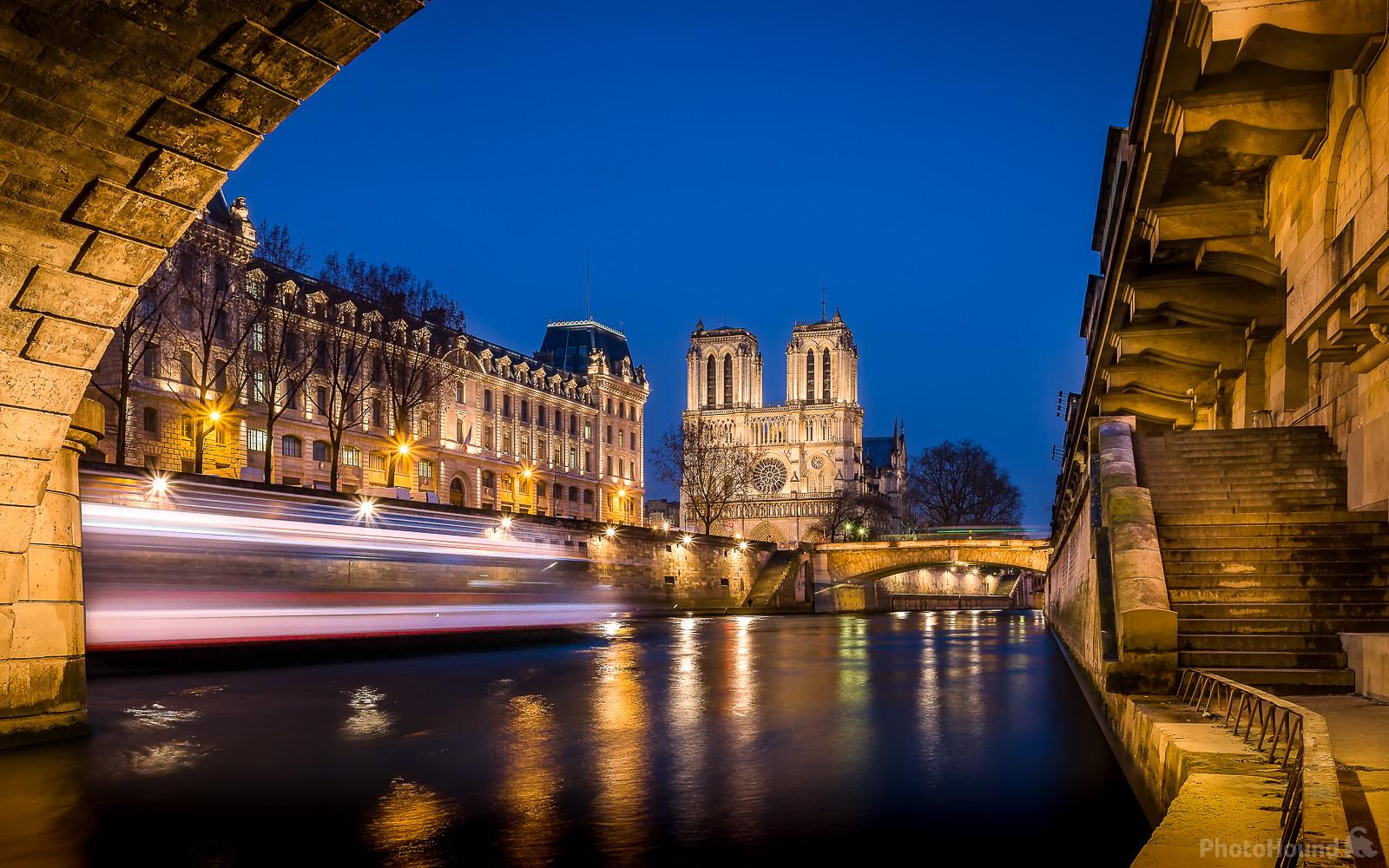 Image of Notre Dame de Paris from beneath Pont St-Michel by Frédéric Monin