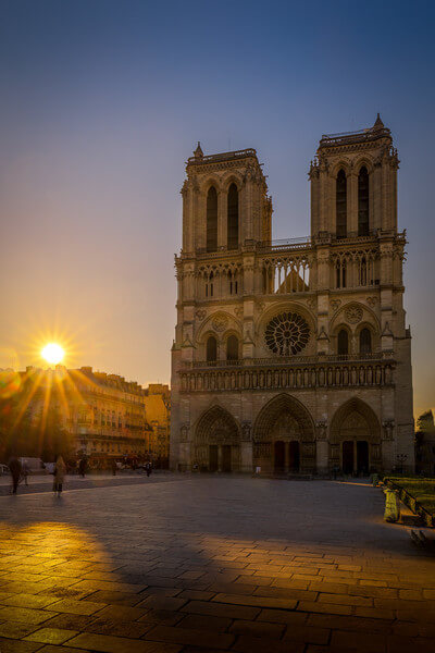 Sunrise on the cathedral Notre Dame de Paris seen from the Parvis Notre Dame - Place Jean-Paul II.