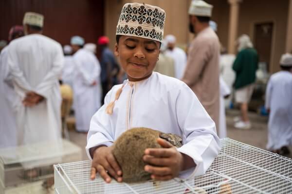 Omani boy and his rabbit