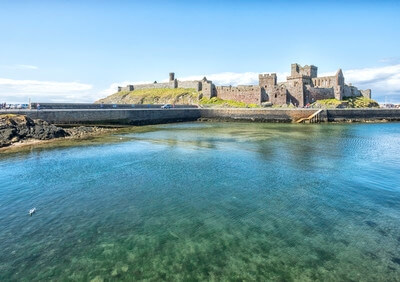 Peel Castle captured from the opposite harbour wall. A polarising filter helps on a calm day.