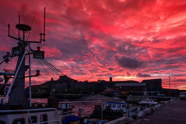 Dramatic sunsets never fail to impress over Peel Castle. This image is capture from the main breakwater, with the fishing fleet to the fore.