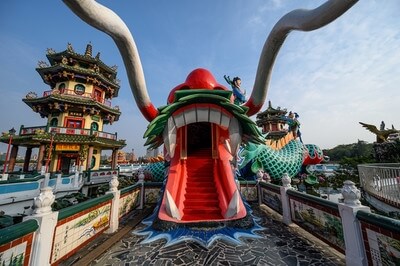 Look into the mouth of a dragon in front of the Spring and Autumn pavilions.