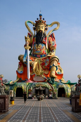 Statue of Taoist God Xuan-Tian-Shang-Di with a temple at the bottom.
