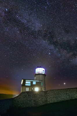 Closer look of the lighthouse with the Milky Way behind it.