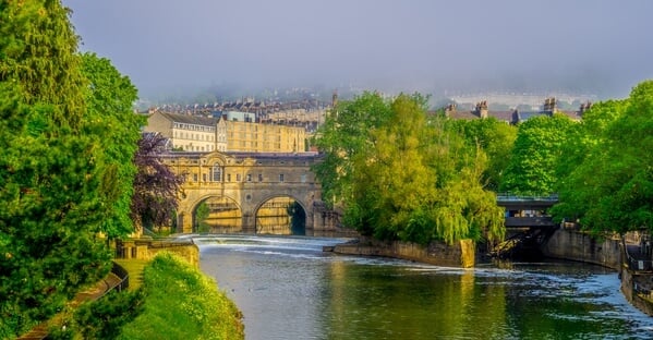 Pulteney Bridge and Bath suburbs from the River Avon