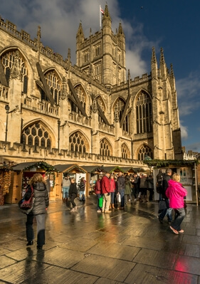 Bath Abbey with the fringes of the Christmas market stalls