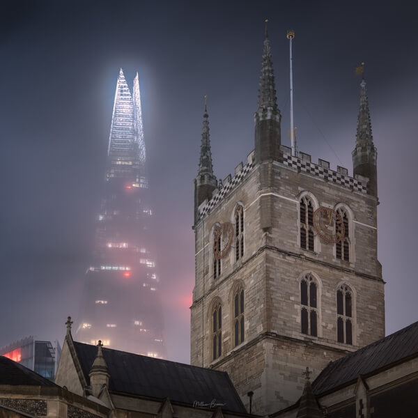 The Shard looms over the cathedral on a foggy night