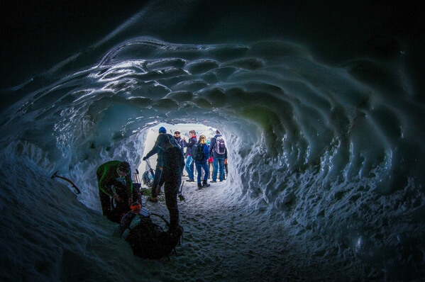 Paragliders  in ice tunnel 